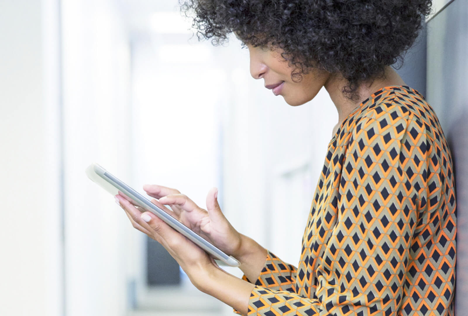 Woman working on tablet at office